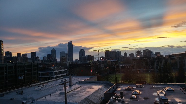The spring day in Seattle departed with rays through lingering levels of moisture